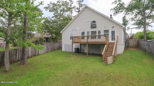 rear view of property with a fenced backyard, central air condition unit, a yard, stairway, and a wooden deck