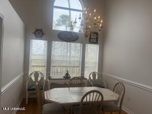 dining area with wood finished floors