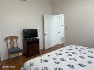 bedroom with lofted ceiling