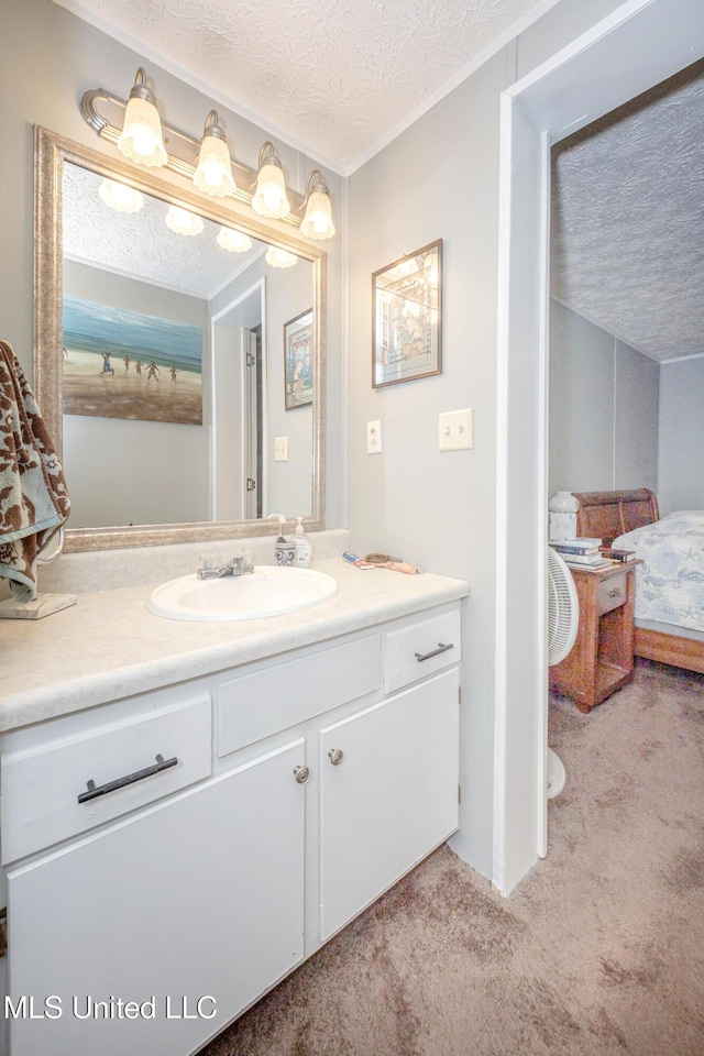 bathroom featuring vanity and a textured ceiling
