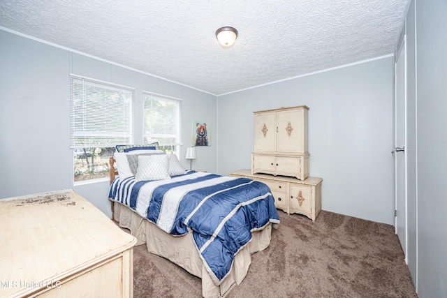 carpeted bedroom featuring a textured ceiling and ornamental molding