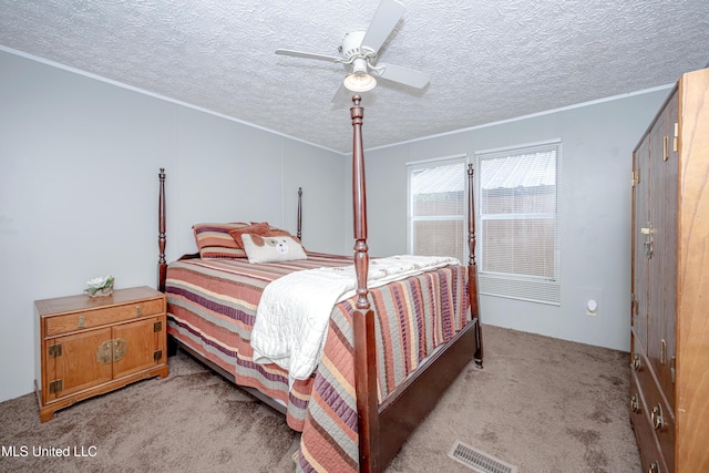 bedroom featuring light carpet, visible vents, ornamental molding, and ceiling fan