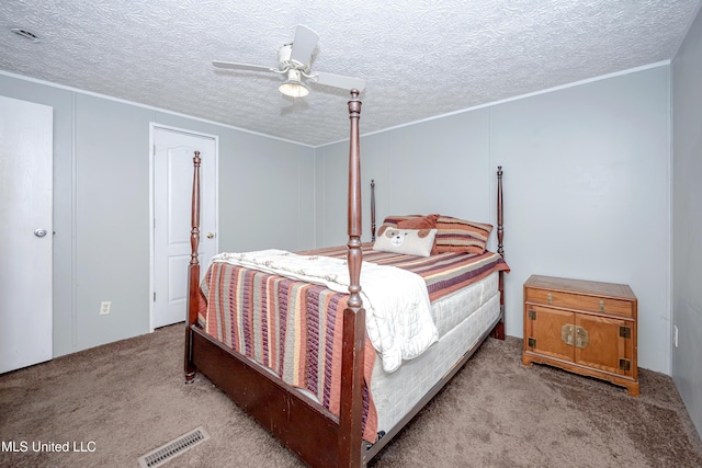 carpeted bedroom featuring ceiling fan, visible vents, a textured ceiling, and ornamental molding