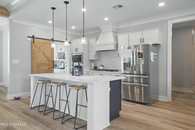 13240 Wolf River Rd, Gulfport, MS 39503 - kitchen featuring stainless steel fridge with ice dispenser, light countertops, baseboards, gas stovetop, and custom exhaust hood