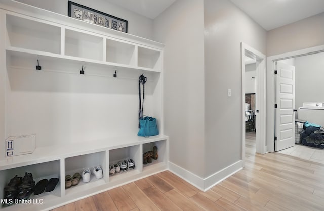 13240 Wolf River Rd, Gulfport, MS 39503 - mudroom featuring baseboards, washer / clothes dryer, and wood finished floors