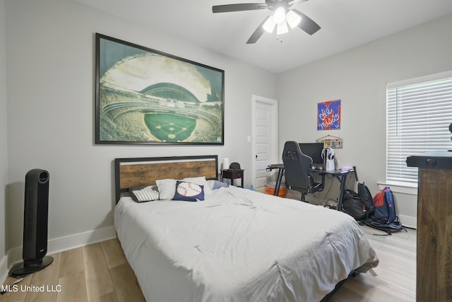 13240 Wolf River Rd, Gulfport, MS 39503 - bedroom with wood finished floors, baseboards, and ceiling fan