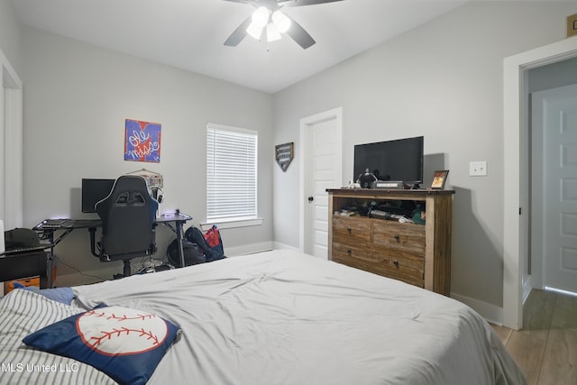 13240 Wolf River Rd, Gulfport, MS 39503 - bedroom featuring wood finished floors, baseboards, and a ceiling fan