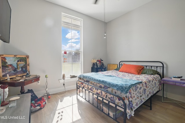 13240 Wolf River Rd, Gulfport, MS 39503 - bedroom with baseboards and wood finished floors