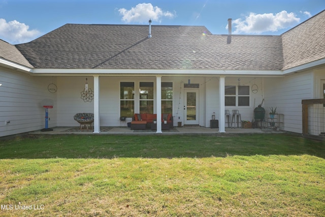 13240 Wolf River Rd, Gulfport, MS 39503 - back of property featuring a lawn, a shingled roof, an outdoor hangout area, and a patio area