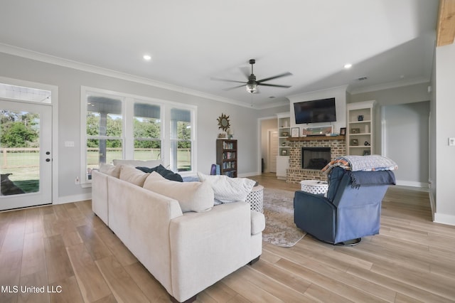 13240 Wolf River Rd, Gulfport, MS 39503 - living area featuring ceiling fan, a wealth of natural light, crown molding, and a brick fireplace
