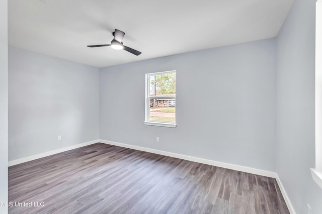 spare room featuring ceiling fan and hardwood / wood-style flooring