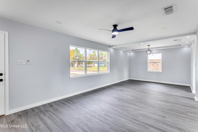 unfurnished room featuring ceiling fan and dark hardwood / wood-style flooring