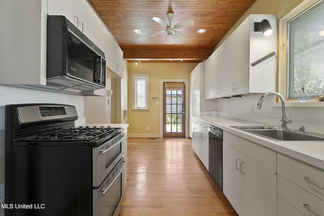 1521 Riverside Dr, Jackson, MS 39202 - kitchen featuring wooden ceiling, ceiling fan, a sink, light wood-style floors, and appliances with stainless steel finishes