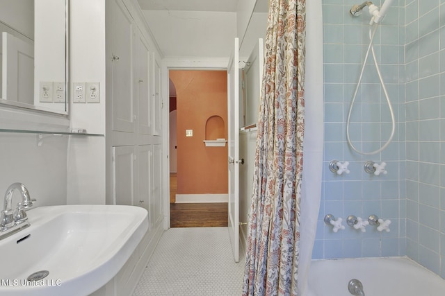 1521 Riverside Dr, Jackson, MS 39202 - full bathroom with a sink, tile patterned floors, and shower / bath combination with curtain