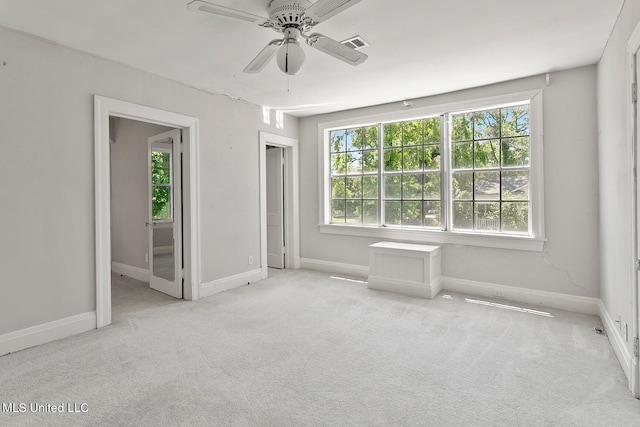 carpeted empty room with ceiling fan