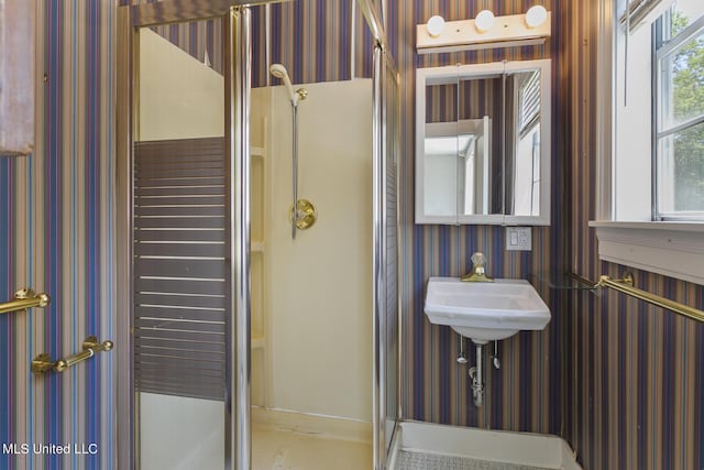 1521 Riverside Dr, Jackson, MS 39202 - bathroom with wallpapered walls and a stall shower