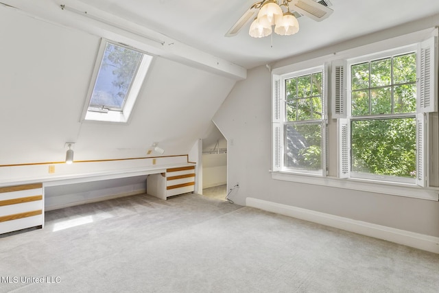 1521 Riverside Dr, Jackson, MS 39202 - bonus room with a ceiling fan, carpet flooring, a skylight, and baseboards