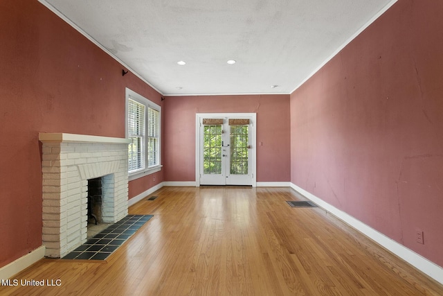 1521 Riverside Dr, Jackson, MS 39202 - unfurnished living room featuring a fireplace, crown molding, baseboards, and visible vents
