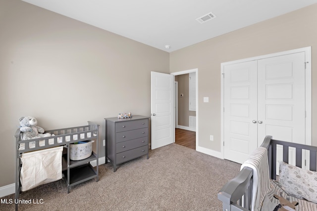 19489 Little Manatee St, Biloxi, MS 39532 - bedroom with carpet, a closet, and baseboards
