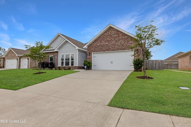 19489 Little Manatee St, Biloxi, MS 39532 - view of front of property featuring brick siding, driveway, a garage, and board and batten siding