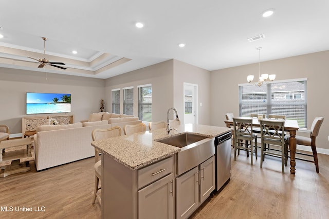 19489 Little Manatee St, Biloxi, MS 39532 - kitchen featuring a sink, stainless steel dishwasher, ornamental molding, an island with sink, and light wood-type flooring