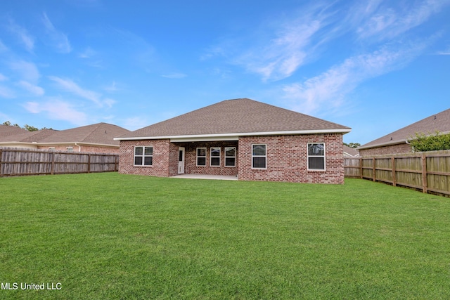 19489 Little Manatee St, Biloxi, MS 39532 - back of property featuring brick siding, a patio area, and a shingled roof