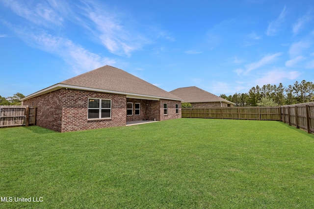 19489 Little Manatee St, Biloxi, MS 39532 - back of house featuring brick siding, roof with shingles, and a patio