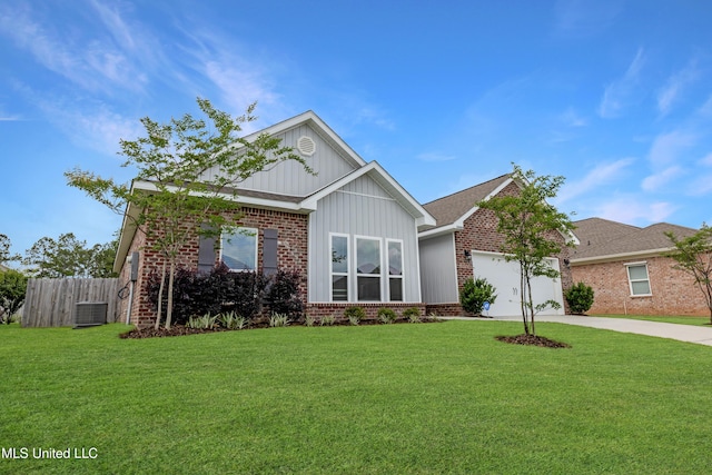 19489 Little Manatee St, Biloxi, MS 39532 - view of front of home with brick siding, concrete driveway, an attached garage, board and batten siding, and central air condition unit