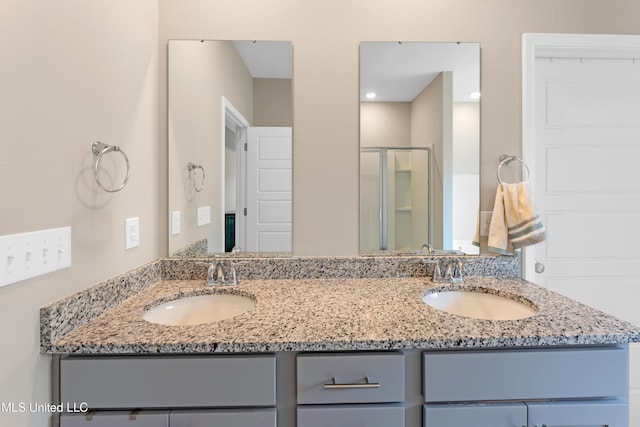 19489 Little Manatee St, Biloxi, MS 39532 - bathroom featuring double vanity and a stall shower