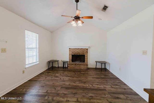 unfurnished living room featuring a ceiling fan, visible vents, dark wood finished floors, lofted ceiling, and a fireplace