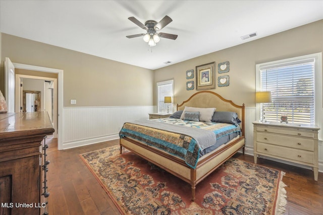 bedroom with dark wood-type flooring and ceiling fan