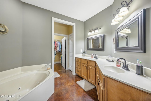 bathroom with vanity, concrete floors, and a washtub