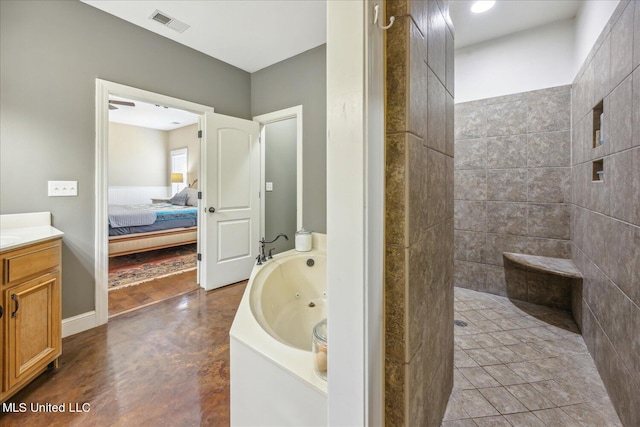 bathroom featuring vanity, concrete floors, and shower with separate bathtub