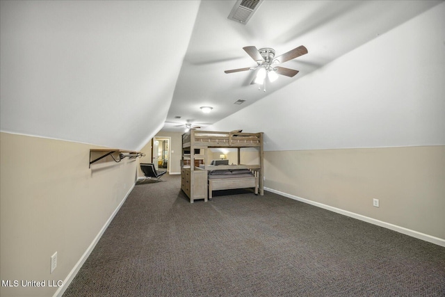 carpeted bedroom with vaulted ceiling and ceiling fan