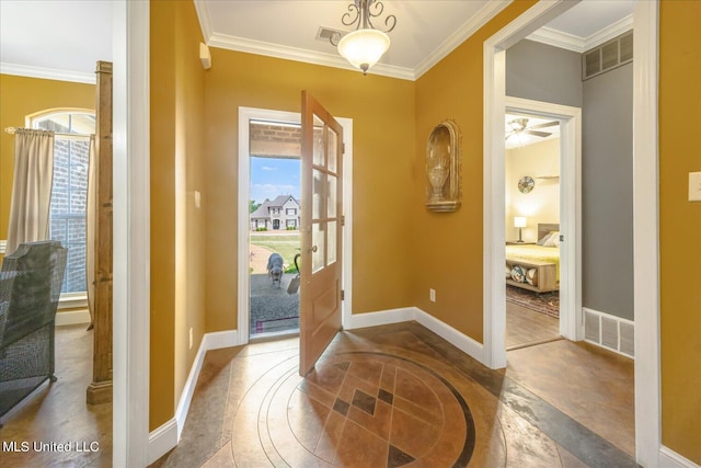 entryway with ornamental molding and ceiling fan