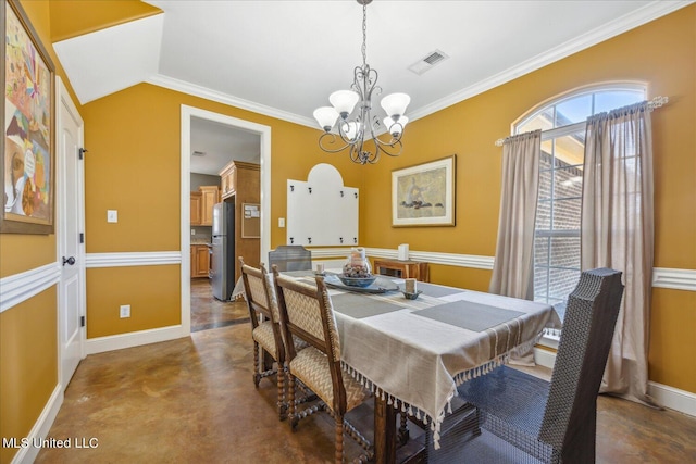 dining area featuring crown molding, vaulted ceiling, and a chandelier