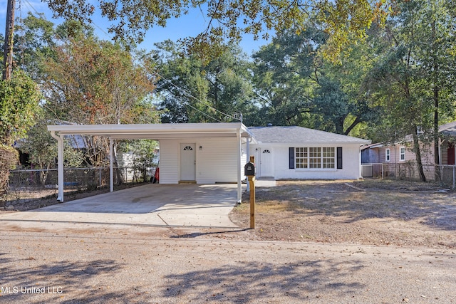 view of front of property with central AC unit and a carport