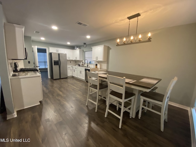 dining area featuring visible vents, dark wood finished floors, baseboards, a chandelier, and recessed lighting