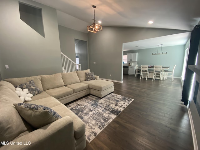 living room featuring dark wood finished floors, vaulted ceiling, baseboards, and recessed lighting