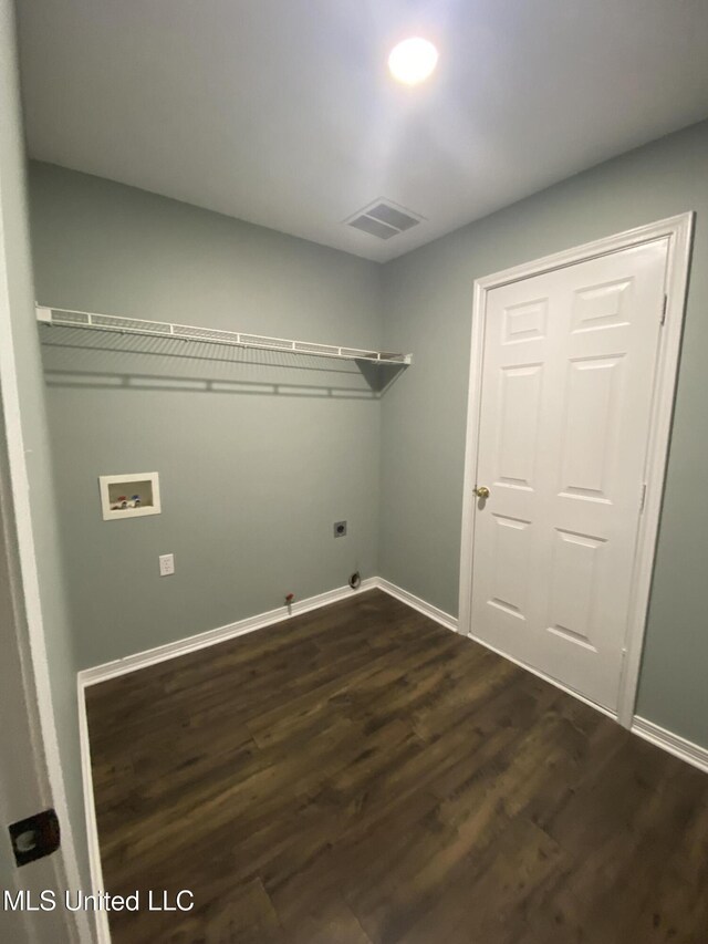 washroom featuring laundry area, visible vents, gas dryer hookup, dark wood-style floors, and washer hookup