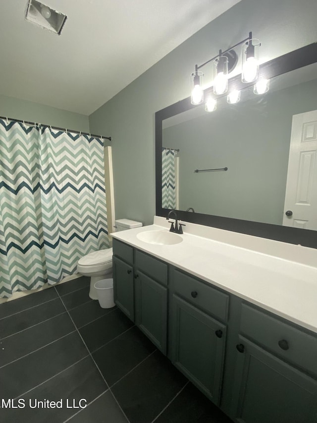 bathroom with vanity, tile patterned flooring, toilet, and a shower with curtain