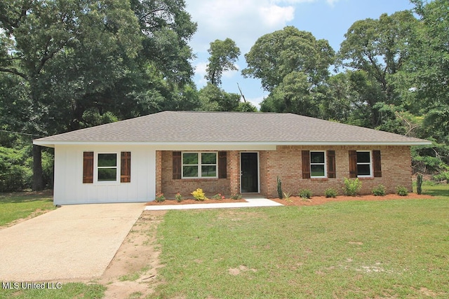 136 Childress Rd, Lucedale, MS 39452 - single story home with board and batten siding, brick siding, a front yard, driveway, and roof with shingles