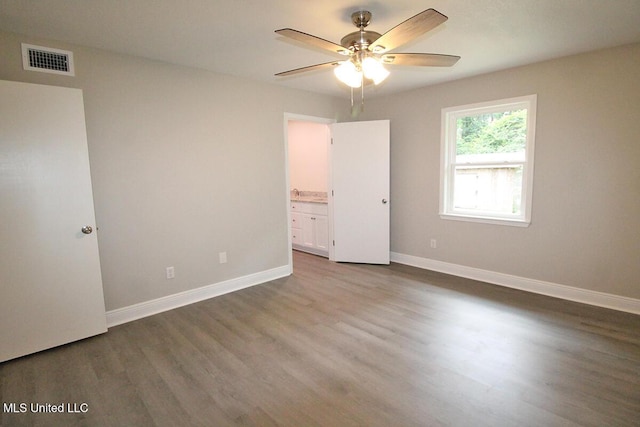 136 Childress Rd, Lucedale, MS 39452 - unfurnished bedroom featuring wood finished floors, baseboards, ensuite bathroom, and ceiling fan
