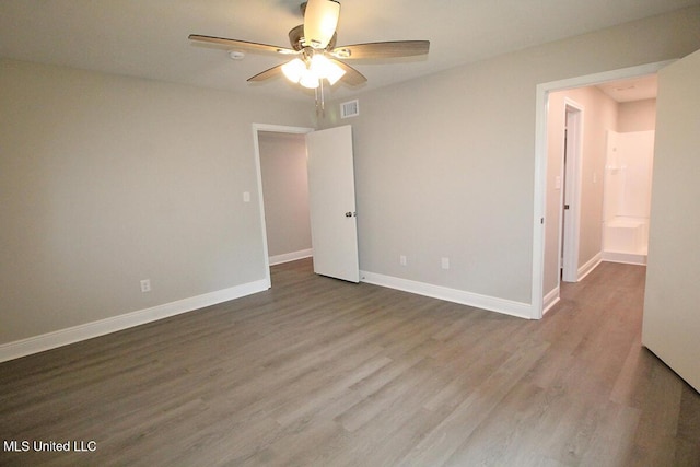 136 Childress Rd, Lucedale, MS 39452 - spare room featuring a ceiling fan, wood finished floors, and baseboards