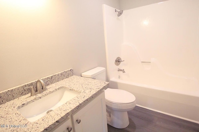 136 Childress Rd, Lucedale, MS 39452 - full bathroom with toilet, vanity, wood finished floors, and  shower combination