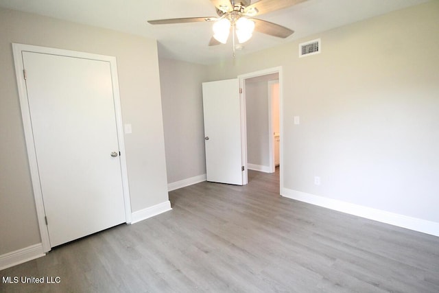136 Childress Rd, Lucedale, MS 39452 - unfurnished bedroom featuring wood finished floors, baseboards, and ceiling fan