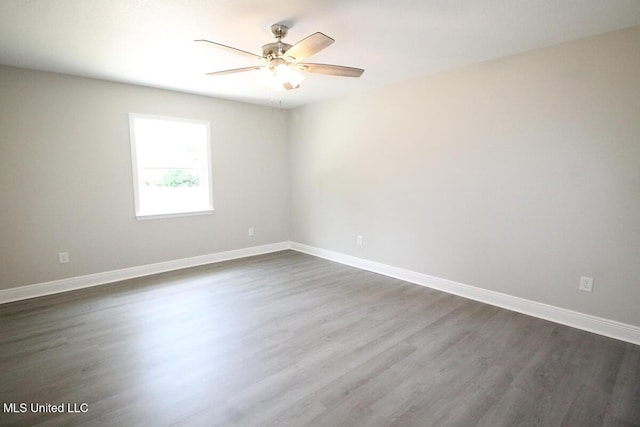 136 Childress Rd, Lucedale, MS 39452 - empty room with ceiling fan, dark wood-type flooring, and baseboards