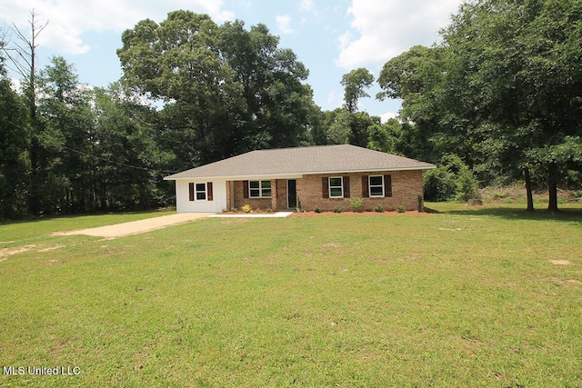 136 Childress Rd, Lucedale, MS 39452 - single story home with a front lawn, driveway, and brick siding