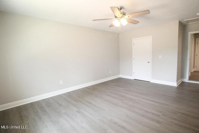 136 Childress Rd, Lucedale, MS 39452 - spare room with dark wood-style flooring, ceiling fan, and baseboards