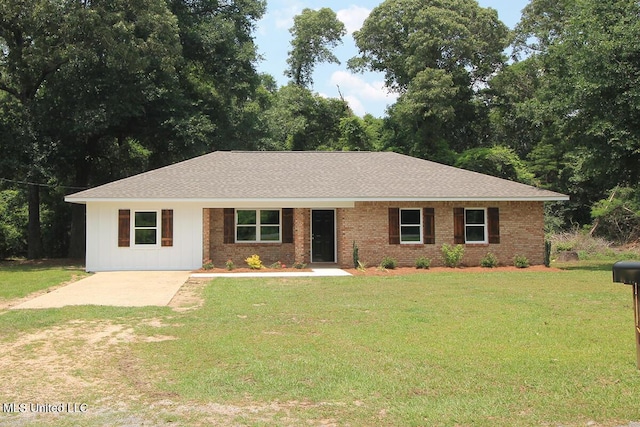 136 Childress Rd, Lucedale, MS 39452 - single story home with a front yard, brick siding, roof with shingles, and driveway
